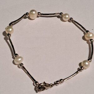 silver color and pearl like beaded bracelet